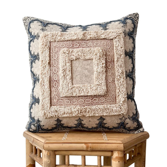 Handmade Siya cushion cover featuring a central mauve and pinkish-tan tufted square, cream borders, and a dark navy geometric pattern on the background.