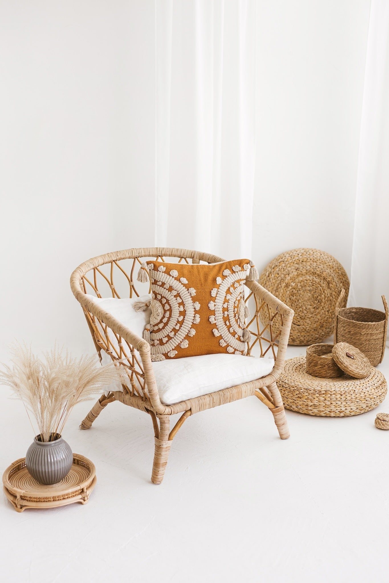 Studio detail of the Ira cushion cover highlighting the rich ochre canvas, textured cream popcorn dot tufts, and heavy looped yarn rings.